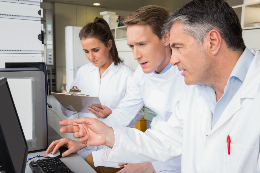 Scientists around a computer