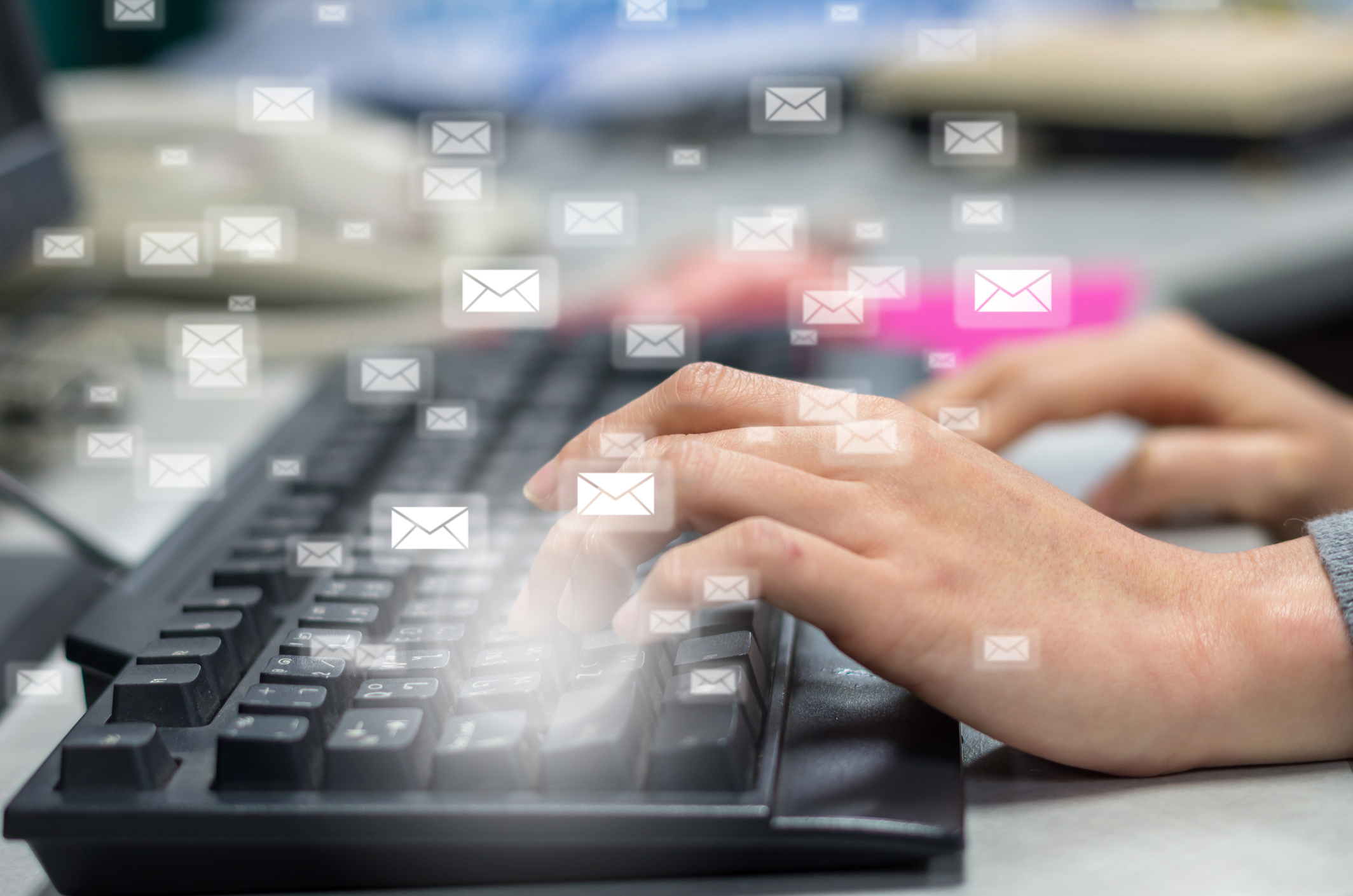 Many e-mail over the finger pressing the computer keyboard blurred background, business technology concept