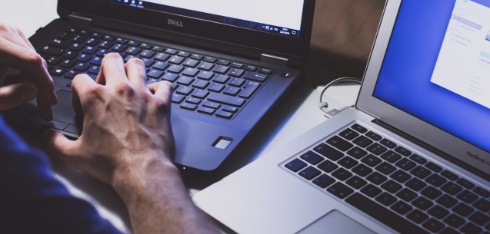 Man typing on laptop